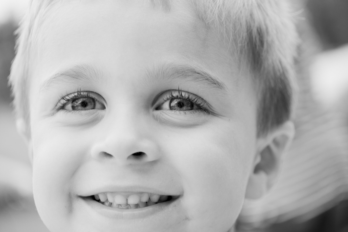 grayscale-photo-of-toddler-smiling-1118429.jpg